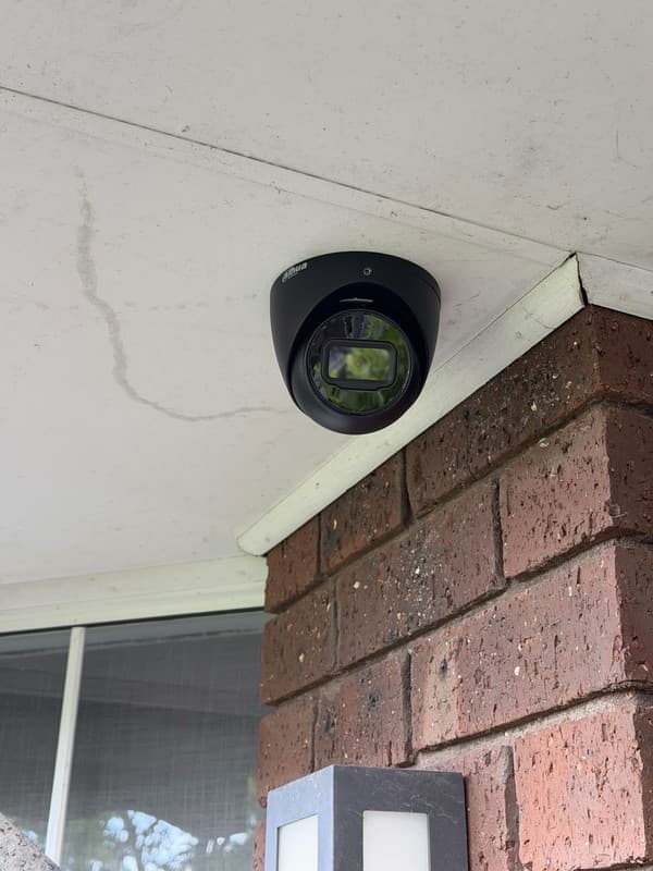 Atlas Sec installation — Turret camera, brick eave